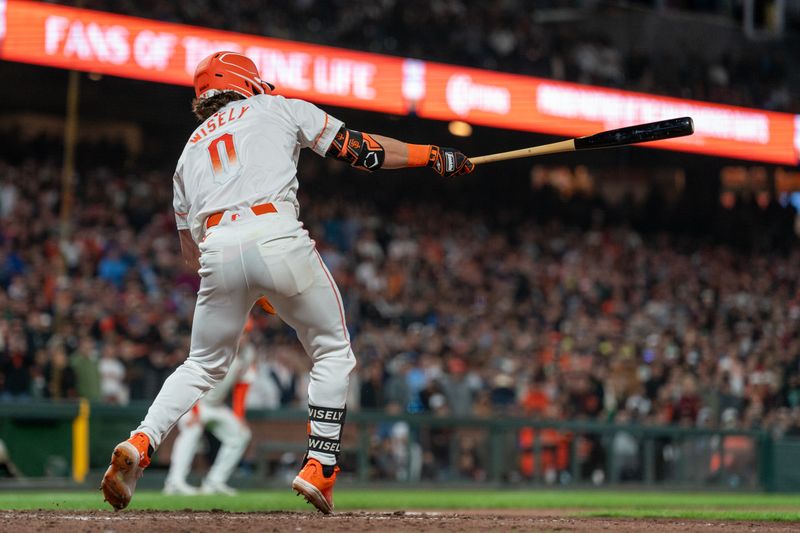 Jul 9, 2024; San Francisco, California, USA;  San Francisco Giants shortstop Brett Wisely (0) singles on a ground ball scoring San Francisco Giants catcher Patrick Bailey (not pictured) to tie the game against the Toronto Blue Jays during the ninth inning at Oracle Park. Mandatory Credit: Neville E. Guard-USA TODAY Sports