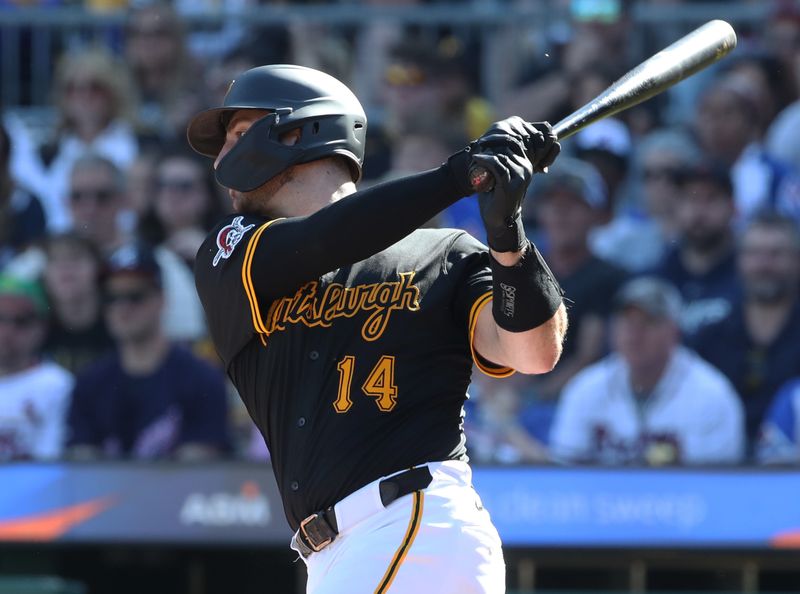 May 10, 2025; Pittsburgh, Pennsylvania, USA;  Pittsburgh Pirates catcher Joey Bart (14) hits an RBI single against the Atlanta Braves during the third inning at PNC Park. Mandatory Credit: Charles LeClaire-Imagn Images