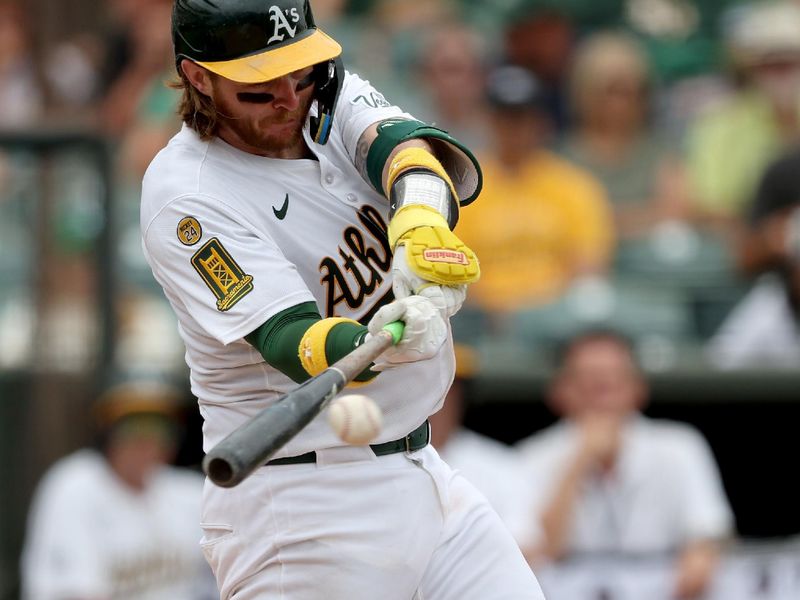 Sep 28, 2025; West Sacramento, California, USA; Athletics catcher Willie Maclver (65) hits a single against the Kansas City Royals during the fifth inning at Sutter Health Park. Mandatory Credit: Dennis Lee-Imagn Images