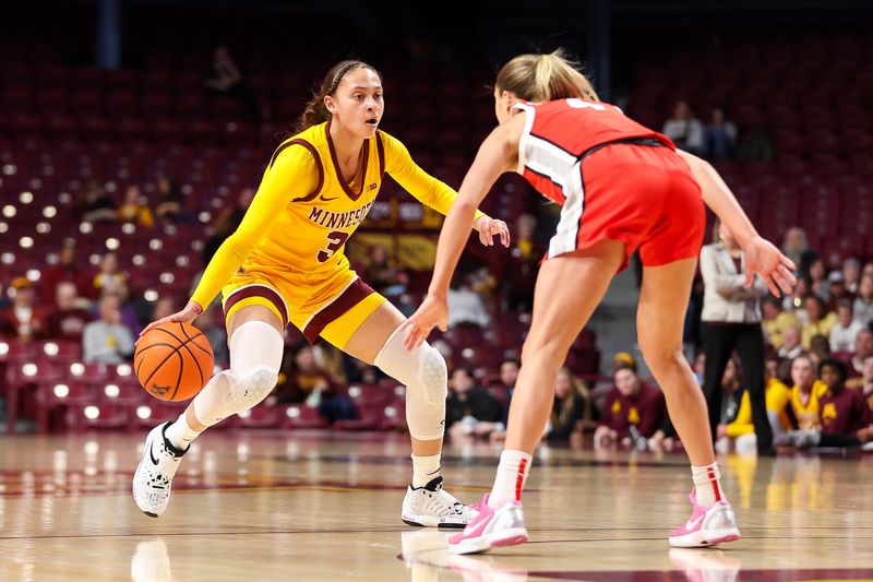 Feb 8, 2024; Minneapolis, Minnesota, USA; Minnesota Golden Gophers guard Amaya Battle (3) dribbles as Ohio State Buckeyes guard Jacy Sheldon (4) defends during the first half at Williams Arena. Mandatory Credit: Matt Krohn-USA TODAY Sports