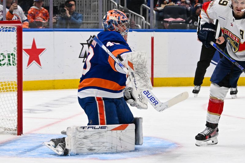 Oct 26, 2024; Elmont, New York, USA;  New York Islanders goaltender Semyon Varlamov (40) makes a save against the Florida Panthers during the first period at UBS Arena. Mandatory Credit: Dennis Schneidler-Imagn Images