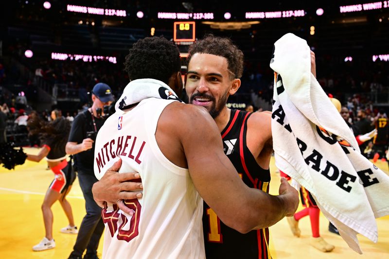 ATLANTA, GA - NOVEMBER 29: Donovan Mitchell #45 of the Cleveland Cavaliers and Trae Young #11 of the Atlanta Hawks embrace after the game during the Emirates NBA Cup game on November 29, 2024 at State Farm Arena in Atlanta, Georgia.  NOTE TO USER: User expressly acknowledges and agrees that, by downloading and/or using this Photograph, user is consenting to the terms and conditions of the Getty Images License Agreement. Mandatory Copyright Notice: Copyright 2024 NBAE (Photo by Adam Hagy/NBAE via Getty Images)