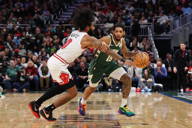 MILWAUKEE, WISCONSIN - DECEMBER 11: Cameron Payne #15 of the Milwaukee Bucks drives around Coby White #0 of the Chicago Bulls during a game at Fiserv Forum on December 11, 2023 in Milwaukee, Wisconsin. NOTE TO USER: User expressly acknowledges and agrees that, by downloading and or using this photograph, User is consenting to the terms and conditions of the Getty Images License Agreement. (Photo by Stacy Revere/Getty Images)