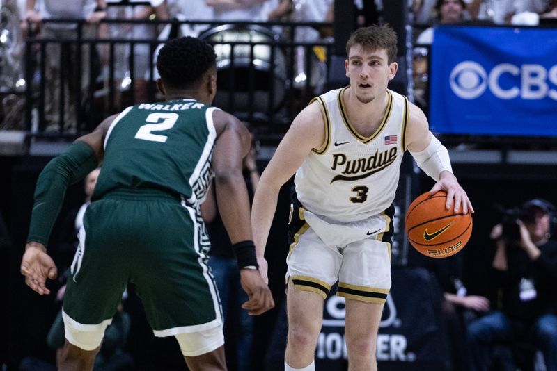 Jan 29, 2023; West Lafayette, Indiana, USA;  Purdue Boilermakers guard Braden Smith (3) dribbles the ball while Michigan State Spartans guard Tyson Walker (2) defends in the second half at Mackey Arena. Mandatory Credit: Trevor Ruszkowski-USA TODAY Sports