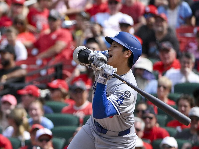 Jun 8, 2025; St. Louis, Missouri, USA;  Los Angeles Dodgers designated hitter Shohei Ohtani (17) reacts after he was hit by a pitch by St. Louis Cardinals relief pitcher Matt Svanson (not pictured) during the eighth inning at Busch Stadium. Mandatory Credit: Jeff Curry-Imagn Images