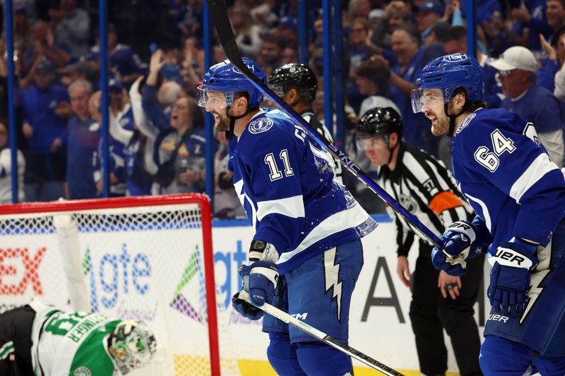 Dec 4, 2023; Tampa, Florida, USA; Tampa Bay Lightning center Luke Glendening (11) is congratulated by Tampa Bay Lightning center Tyler Motte (64) after he scored a goal \D|  during the third period at Amalie Arena. Mandatory Credit: Kim Klement Neitzel-USA TODAY Sports