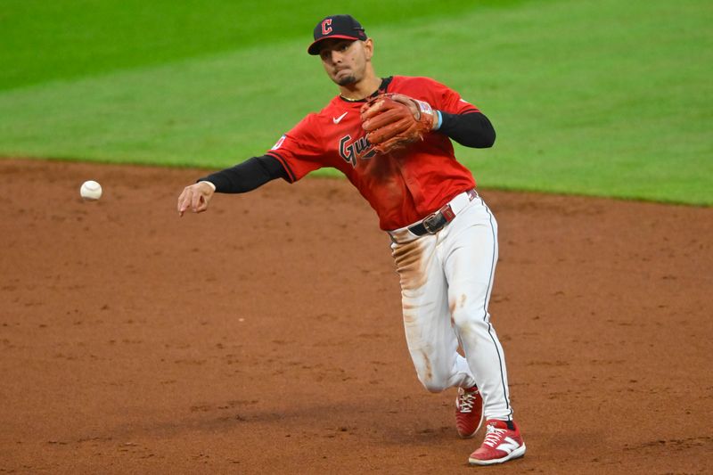 Aug 24, 2024; Cleveland, Ohio, USA; Cleveland Guardians second baseman Andres Gimenez (0) throws to first base in the third inning against the Texas Rangers at Progressive Field. Mandatory Credit: David Richard-USA TODAY Sports