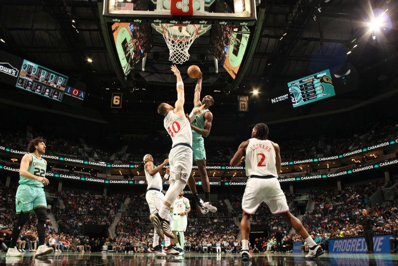 CHARLOTTE, NC - JANUARY 31:  Moussa Diabate #14 of the Charlotte Hornets dunks the ball during the game against the LA Clippers on January 31, 2025 at Spectrum Center in Charlotte, North Carolina. NOTE TO USER: User expressly acknowledges and agrees that, by downloading and or using this photograph, User is consenting to the terms and conditions of the Getty Images License Agreement. Mandatory Copyright Notice: Copyright 2025 NBAE (Photo by Kent Smith/NBAE via Getty Images)