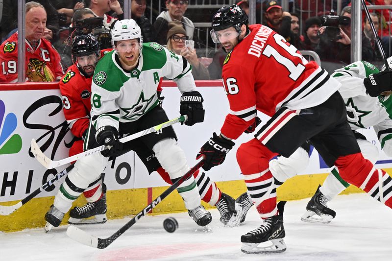 Jan 13, 2024; Chicago, Illinois, USA;  Dallas Stars forward Joe Pavelski (16) passes off the puck past Chicago Blackhawks forward Jason Dickinson (16) in the third period at United Center. Mandatory Credit: Jamie Sabau-USA TODAY Sports