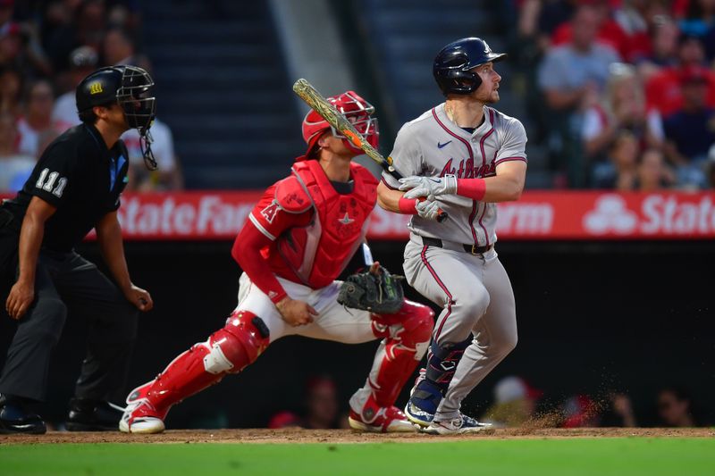 August 16, 2024; Anaheim, California, USA; Atlanta Braves left fielder Jarred Kelenic (24) hits an RBI single against the Los Angeles Angels during the fourth inning at Angel Stadium. Mandatory Credit: Gary A. Vasquez-USA TODAY Sports