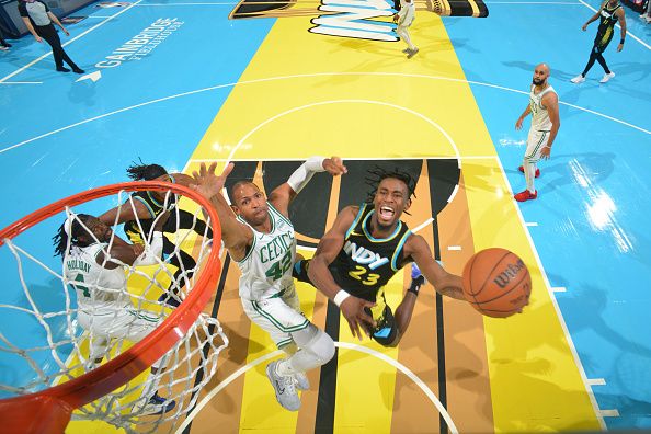 INDIANAPOLIS, IN - DECEMBER 4: Aaron Nesmith #23 of the Indiana Pacers drives to the basket during the game against the Boston Celtics during the quarterfinals of the In-Season Tournament on December 4, 2023 at Gainbridge Fieldhouse in Indianapolis, Indiana. NOTE TO USER: User expressly acknowledges and agrees that, by downloading and or using this Photograph, user is consenting to the terms and conditions of the Getty Images License Agreement. Mandatory Copyright Notice: Copyright 2023 NBAE (Photo by Jesse D. Garrabrant/NBAE via Getty Images)