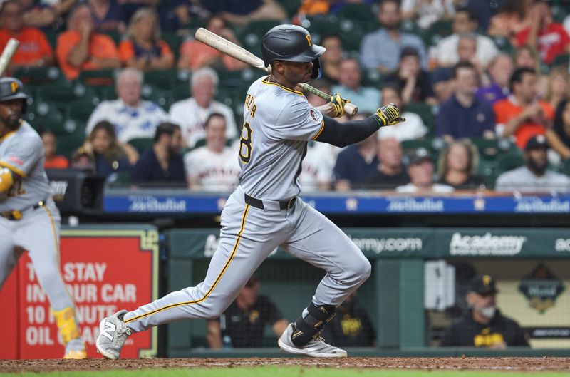 Jul 30, 2024; Houston, Texas, USA; Pittsburgh Pirates center fielder Michael A. Taylor (18) reaches safely on a fielding error by Houston Astros shortstop Jeremy Pena (not pictured) during the eighth inning at Minute Maid Park. Mandatory Credit: Troy Taormina-USA TODAY Sports