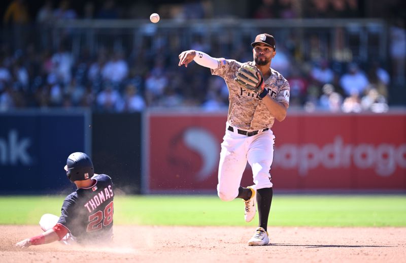 Jun 25, 2023; San Diego, California, USA; San Diego Padres shortstop Xander Bogaerts (2) throws to first base after forcing out Washington Nationals right fielder Lane Thomas (28) at second base during the eighth inning at Petco Park. Mandatory Credit: Orlando Ramirez-USA TODAY Sports