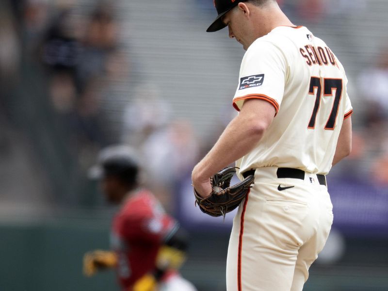 Sep 10, 2025; San Francisco, California, USA; San Francisco Giants starting pitcher Carson Seymour (77) waits while Arizona Diamondbacks shortstop Geraldo Perdomo (2) runs out his solo home run during the first inning at Oracle Park. Mandatory Credit: D. Ross Cameron-Imagn Images
