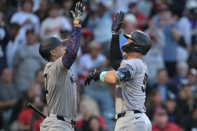 May 30, 2024; Anaheim, California, USA;  New York Yankees center fielder Aaron Judge (99) is congratulated by designated hitter Giancarlo Stanton (27) after hitting a two-run home run in the fourth inning against the Los Angeles Angels at Angel Stadium. Mandatory Credit: Jayne Kamin-Oncea-USA TODAY Sports