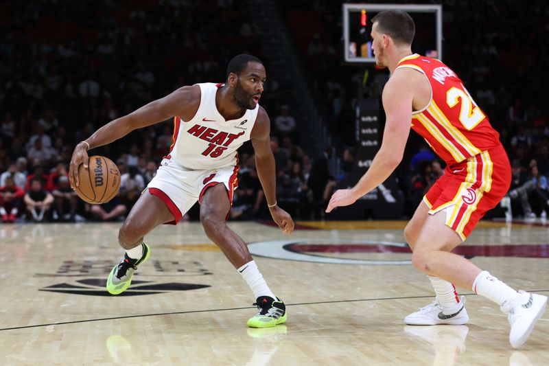 MIAMI, FLORIDA - OCTOBER 16: Alec Burks #18 of the Miami Heat dribbles the ball against the Atlanta Hawks during the third quarter of a preseason game at Kaseya Center on October 16, 2024 in Miami, Florida. NOTE TO USER: User expressly acknowledges and agrees that, by downloading and or using this photograph, User is consenting to the terms and conditions of the Getty Images License Agreement. (Photo by Megan Briggs/Getty Images)