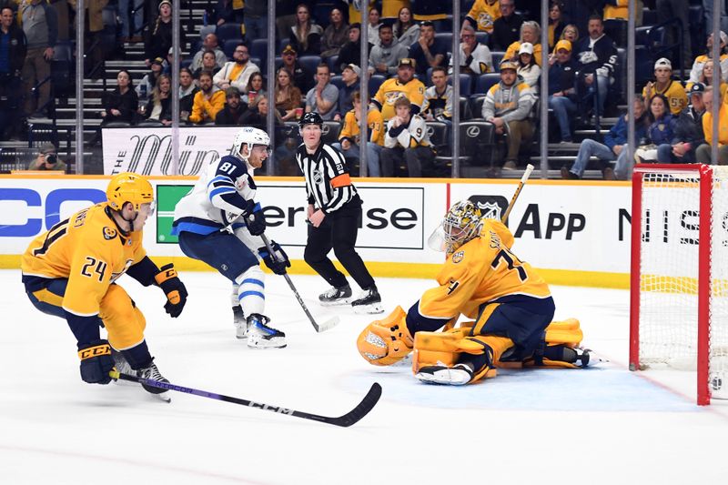 Apr 9, 2024; Nashville, Tennessee, USA; Winnipeg Jets left wing Kyle Connor (81) scores against Nashville Predators goaltender Juuse Saros (74) in overtime to win at Bridgestone Arena. Mandatory Credit: Christopher Hanewinckel-USA TODAY Sports