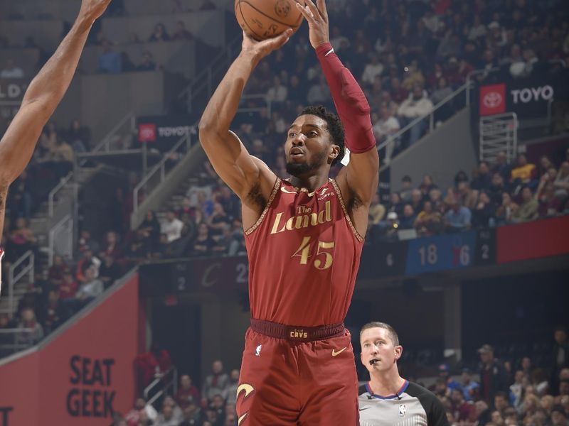 CLEVELAND, OH - FEBRUARY 12: Donovan Mitchell #45 of the Cleveland Cavaliers shoots a three point basket during the game against the Philadelphia 76ers on February 12, 2024 at Rocket Mortgage FieldHouse in Cleveland, Ohio. NOTE TO USER: User expressly acknowledges and agrees that, by downloading and/or using this Photograph, user is consenting to the terms and conditions of the Getty Images License Agreement. Mandatory Copyright Notice: Copyright 2024 NBAE (Photo by David Liam Kyle/NBAE via Getty Images)