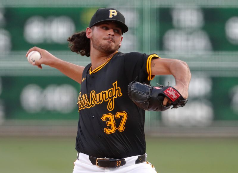 Aug 27, 2024; Pittsburgh, Pennsylvania, USA;  Pittsburgh Pirates starting pitcher Jared Jones (37) delivers a pitch against the Chicago Cubs during the first inning at PNC Park. Mandatory Credit: Charles LeClaire-USA TODAY Sports