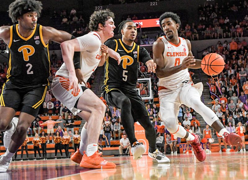 Feb 27, 2024; Clemson, South Carolina, USA; Clemson sophomore guard Joshua Beadle (0) dribbles near Pitt guard Ishmael Leggett (5) during the second half at Littlejohn Coliseum. Mandatory Credit: Ken Ruinard-USA TODAY Sports