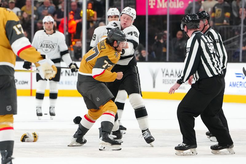 Feb 5, 2026; Las Vegas, Nevada, USA; Los Angeles Kings center Samuel Helenius (79) fights Vegas Golden Knights center Kai Uchacz (77) during the first period at T-Mobile Arena. Mandatory Credit: Stephen R. Sylvanie-Imagn Images