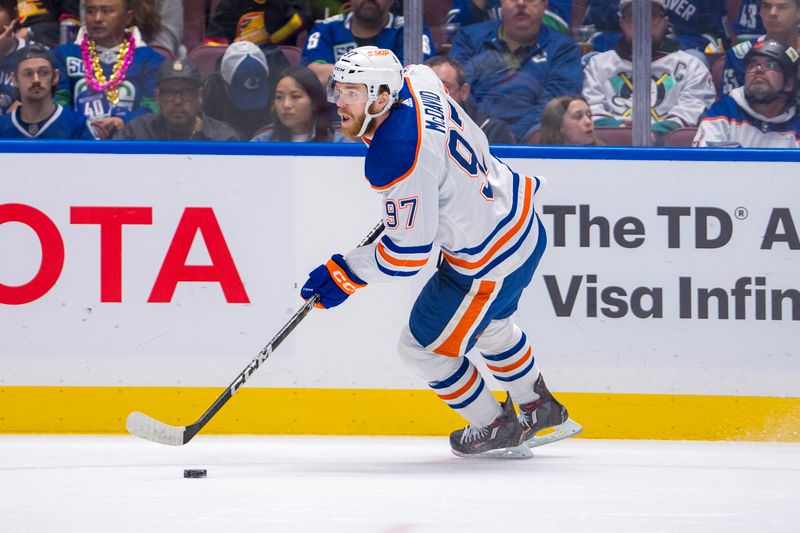 May 20, 2024; Vancouver, British Columbia, CAN; Edmonton Oilers forward Connor McDavid (97) handles the puck against the Vancouver Canucks during the first period in game seven of the second round of the 2024 Stanley Cup Playoffs at Rogers Arena. Mandatory Credit: Bob Frid-USA TODAY Sports