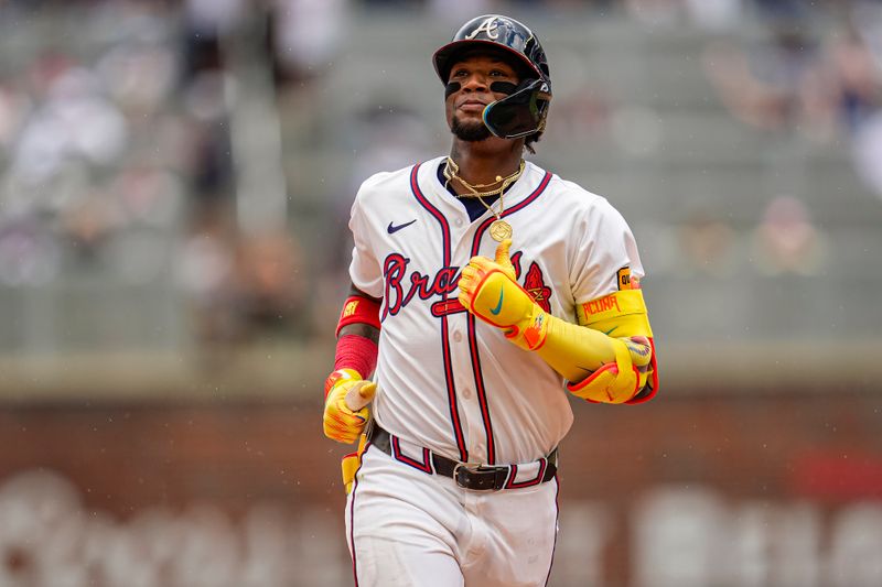 Jul 20, 2025; Cumberland, Georgia, USA; Atlanta Braves right fielder Ronald Acuna Jr (13) reacts after hitting a home run against the New York Yankees during the ninth inning at Truist Park. Mandatory Credit: Dale Zanine-Imagn Images