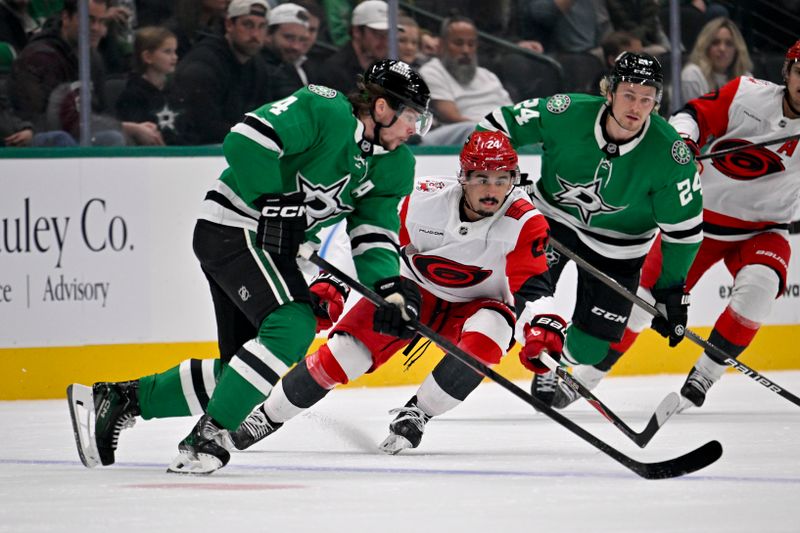 Oct 25, 2025; Dallas, Texas, USA; Dallas Stars defenseman Miro Heiskanen (4) skates in front of Carolina Hurricanes center Seth Jarvis (24) during the first period at the American Airlines Center. Mandatory Credit: Jerome Miron-Imagn Images