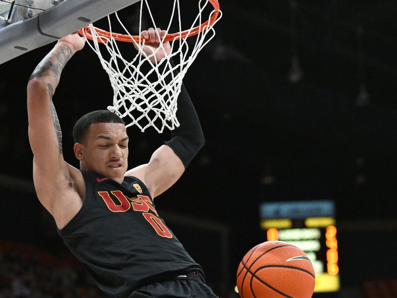 Feb 29, 2024; Pullman, Washington, USA; USC Trojans guard Kobe Johnson (0) dunks the ball against Washington State Cougars forward Andrej Jakimovski (23) in the first half at Friel Court at Beasley Coliseum. Mandatory Credit: James Snook-USA TODAY Sports