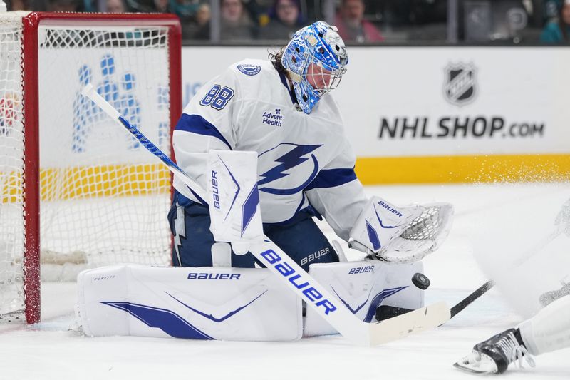 Jan 3, 2026; San Jose, California, USA; Tampa Bay Lightning goaltender Andrei Vasilevskiy (88) makes a save against the San Jose Sharks during the second period at SAP Center at San Jose. Mandatory Credit: Darren Yamashita-Imagn Images