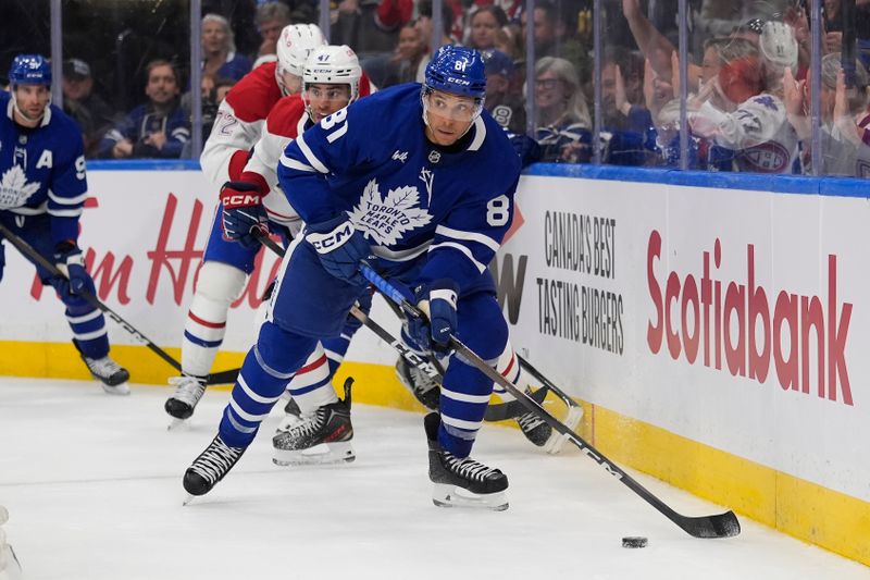 Sep 27, 2025; Toronto, Ontario, CAN; Toronto Maple Leafs forward Dakota Joshua (81) carries the puck against the Montreal Canadiens during the third period at Scotiabank Arena. Mandatory Credit: John E. Sokolowski-Imagn Images