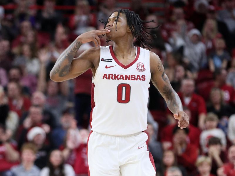 Dec 21, 2023; Fayetteville, Arkansas, USA; Arkansas Razorbacks guard Khalif Battle (0) reacts after shooting a three point shot in the second half against the Abilene Christian Wildcats at Bud Walton Arena. Arkansas won 83-73. Mandatory Credit: Nelson Chenault-USA TODAY Sports