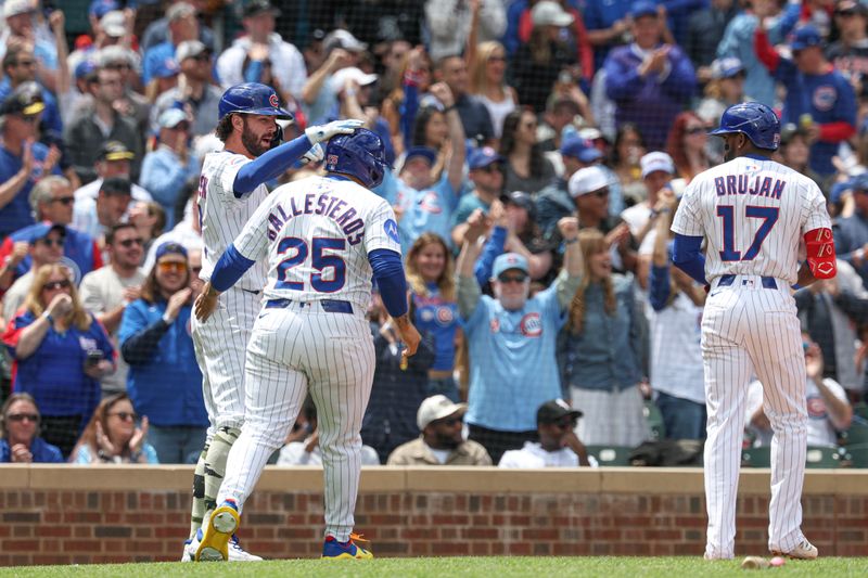 May 17, 2025; Chicago, Illinois, USA; Chicago Cubs designated hitter Moises Ballesteros (25) celebrates with shortstop Dansby Swanson (7) after they both scored against the Chicago White Sox during the second inning at Wrigley Field. Mandatory Credit: Kamil Krzaczynski-Imagn Images