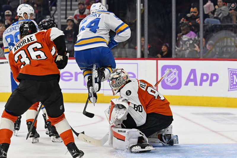 Nov 20, 2025; Philadelphia, Pennsylvania, USA; St. Louis Blues right wing Dalibor Dvorsky (54) leaps over Philadelphia Flyers goaltender Dan Vladar (80) during the second period at Xfinity Mobile Arena. Mandatory Credit: Eric Hartline-Imagn Images