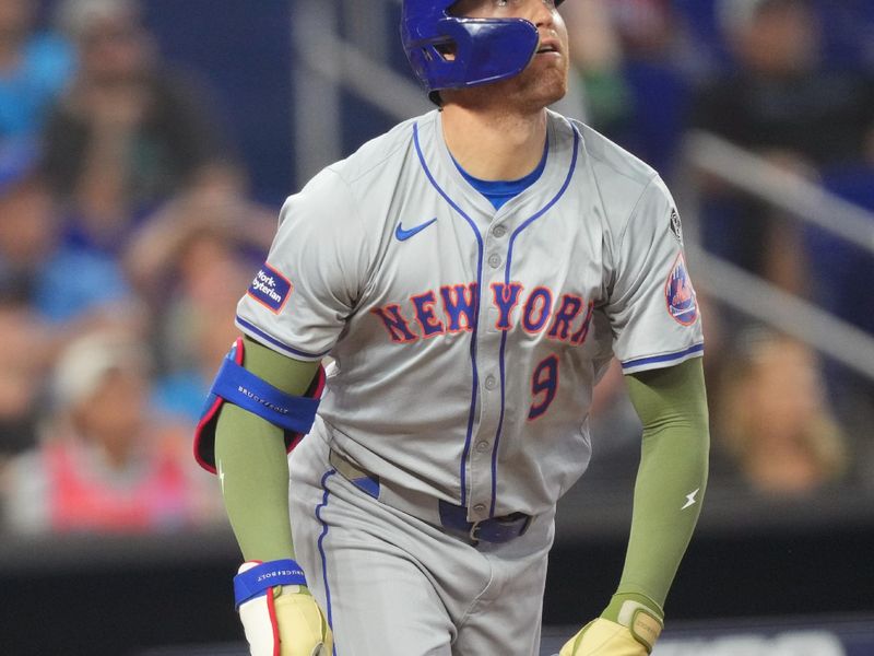 May 19, 2024; Miami, Florida, USA;  New York Mets designated hitter Brandon Nimmo (9) watches his home run in the ninth inning against the Miami Marlins at loanDepot Park. Mandatory Credit: Jim Rassol-USA TODAY Sports