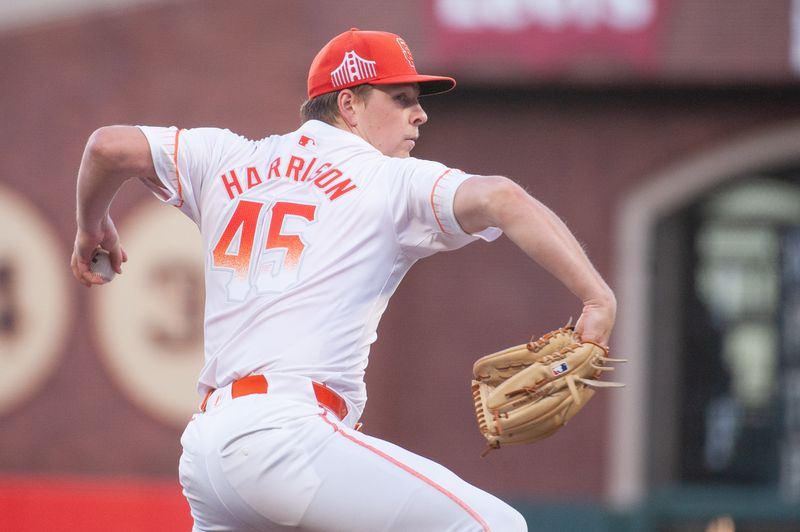 Aug 13, 2024; San Francisco, California, USA;  San Francisco Giants pitcher Kyle Harrison (45) throws a pitch against the Atlanta Braves during the third inning at Oracle Park. Mandatory Credit: Ed Szczepanski-USA TODAY Sports