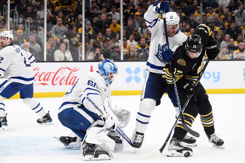 Apr 30, 2024; Boston, Massachusetts, USA; Toronto Maple Leafs defenseman Jake McCabe (22) and Boston Bruins center Charlie Coyle (13) battle in front of goaltender Joseph Woll (60) during the third period in game five of the first round of the 2024 Stanley Cup Playoffs at TD Garden. Mandatory Credit: Bob DeChiara-USA TODAY Sports