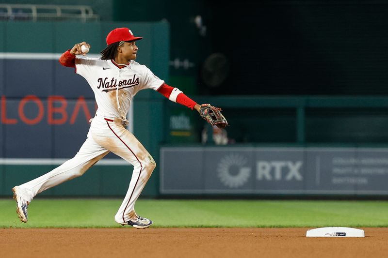 Sep 12, 2024; Washington, District of Columbia, USA; Washington Nationals shortstop CJ Abrams (5) makes a throw to first base after fielding a ground ball by Miami Marlins outfielder Cristian Pache (not pictured) during the fourth inning at Nationals Park. Mandatory Credit: Geoff Burke-Imagn Images