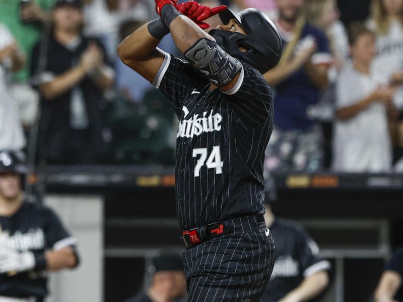 Aug 11, 2023; Chicago, Illinois, USA; Chicago White Sox designated hitter Eloy Jimenez (74) celebrates as he crosses home plate after hitting a two-run home run against the Milwaukee Brewers during the third inning at Guaranteed Rate Field. Mandatory Credit: Kamil Krzaczynski-USA TODAY Sports