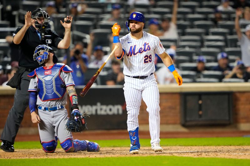 Aug 30, 2023; New York City, New York, USA;  New York Mets right fielder DJ Steward (29) reacts to being hit by a pitch with the bases loaded during the tenth inning against the Texas Rangers at Citi Field. Mandatory Credit: Gregory Fisher-USA TODAY Sports