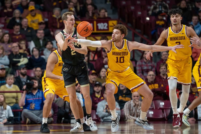 Jan 19, 2023; Minneapolis, Minnesota, USA; Minnesota Golden Gophers forward Jamison Battle (10) defends against Purdue Boilermakers guard Fletcher Loyer (2) in the first half at Williams Arena. Mandatory Credit: Matt Blewett-USA TODAY Sports