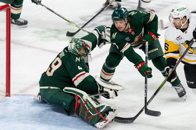 Feb 9, 2024; Saint Paul, Minnesota, USA; Minnesota Wild goaltender Marc-Andre Fleury (29) makes a save as Pittsburgh Penguins center Colin White (36) looks for a rebound in the second period at Xcel Energy Center. Mandatory Credit: Matt Blewett-USA TODAY Sports