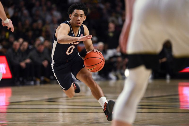 Jan 21, 2023; Winston-Salem, North Carolina, USA;  Virginia Cavaliers guard Kihei Clark (0) drives into an opening in the Wake Forest Demon Deacons defense during the second half at Lawrence Joel Veterans Memorial Coliseum. Mandatory Credit: William Howard-USA TODAY Sports