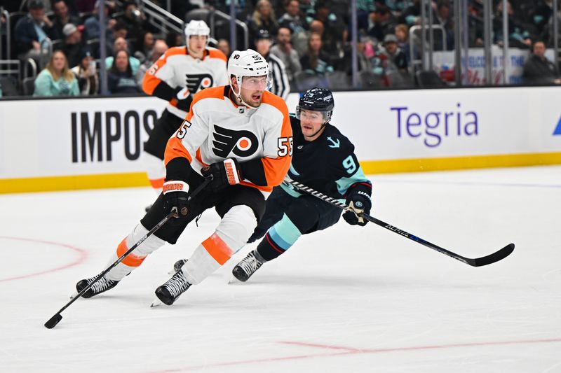 Feb 16, 2023; Seattle, Washington, USA; Philadelphia Flyers defenseman Rasmus Ristolainen (55) advances the puck while being chased by Seattle Kraken center Ryan Donato (9) during the third period at Climate Pledge Arena. Seattle defeated  Philadelphia 6-2. Mandatory Credit: Steven Bisig-USA TODAY Sports