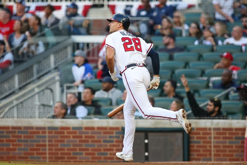 Apr 11, 2023; Atlanta, Georgia, USA; Atlanta Braves first baseman Matt Olson (28) hits a home run against the Cincinnati Reds in the first inning at Truist Park. Mandatory Credit: Brett Davis-USA TODAY Sports
