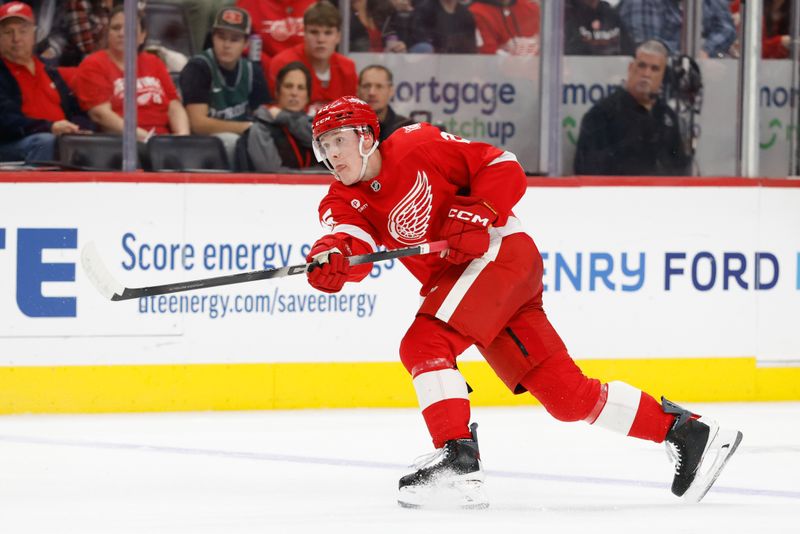 Dec 16, 2025; Detroit, Michigan, USA;  Detroit Red Wings defenseman Jacob Bernard-Docker (25) takes a shot in the second period against the New York Islanders at Little Caesars Arena. Mandatory Credit: Rick Osentoski-Imagn Images