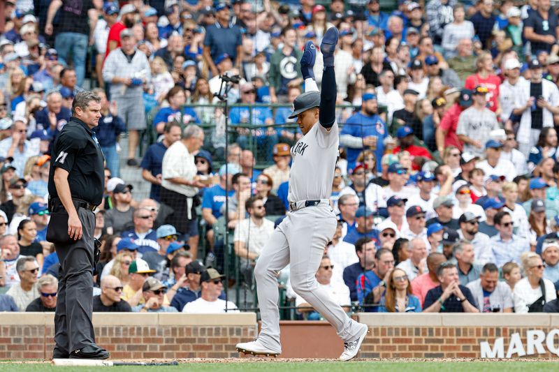 Sep 6, 2024; Chicago, Illinois, USA; New York Yankees outfielder Juan Soto (22) scores against the Chicago Cubs during the third inning at Wrigley Field. Mandatory Credit: Kamil Krzaczynski-Imagn Images