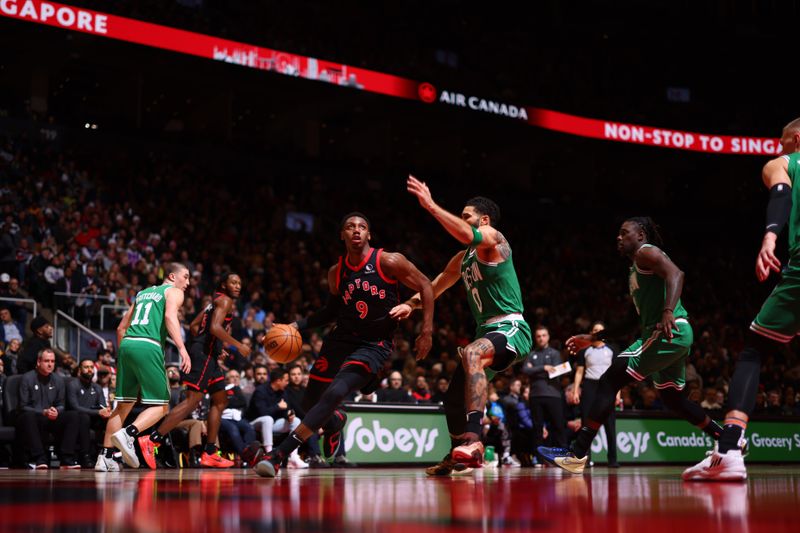 TORONTO, CANADA - JANUARY 15:  RJ Barrett #9 of the Toronto Raptors drives to the basket during the game against the Boston Celtics on January 15, 2024 at the Scotiabank Arena in Toronto, Ontario, Canada.  NOTE TO USER: User expressly acknowledges and agrees that, by downloading and or using this Photograph, user is consenting to the terms and conditions of the Getty Images License Agreement.  Mandatory Copyright Notice: Copyright 2024 NBAE (Photo by Vaughn Ridley/NBAE via Getty Images)