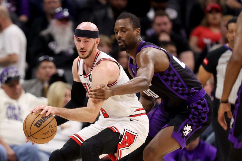 SACRAMENTO, CALIFORNIA - MARCH 04: Alex Caruso #6 of the Chicago Bulls is guarded by Harrison Barnes #40 of the Sacramento Kings in the first half at Golden 1 Center on March 04, 2024 in Sacramento, California. NOTE TO USER: User expressly acknowledges and agrees that, by downloading and or using this photograph, User is consenting to the terms and conditions of the Getty Images License Agreement.  (Photo by Ezra Shaw/Getty Images)