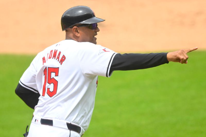 Jul 4, 2024; Cleveland, Ohio, USA; Cleveland Guardians first base and catching coach Sandy Alomar Jr. (15) runs on the field in the first inning against the Chicago White Sox at Progressive Field. Mandatory Credit: David Richard-USA TODAY Sports